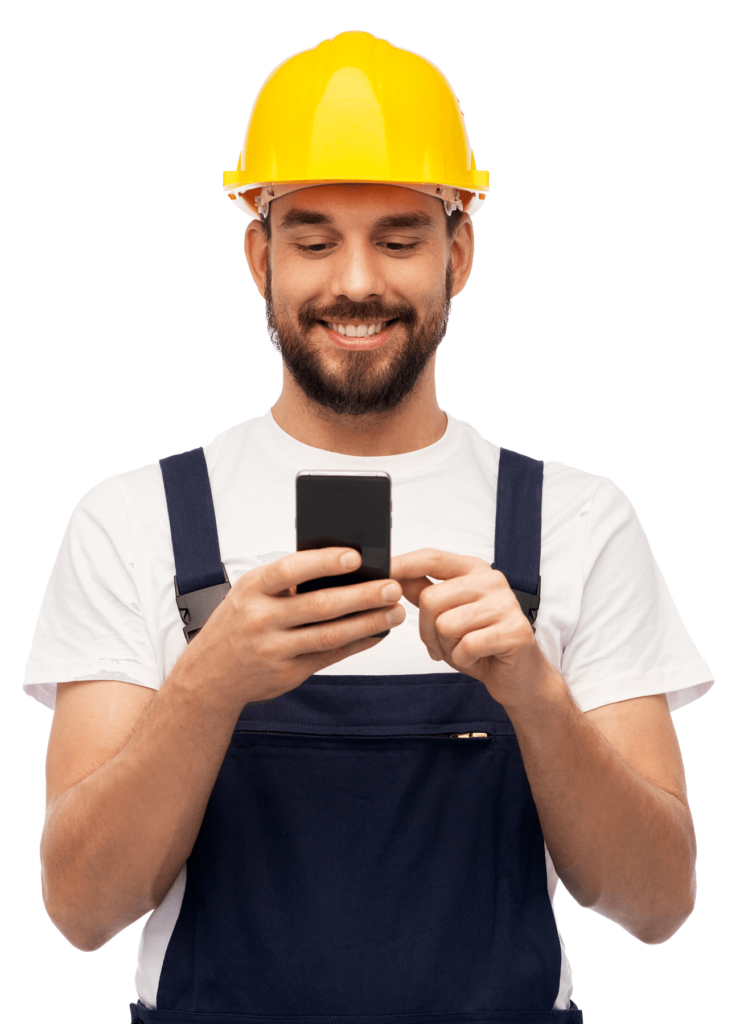 Builder in yellow helmet and overall with smartphone